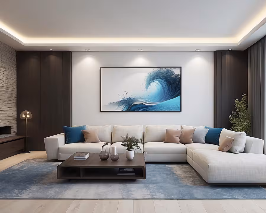 A contemporary living room with cozy grey sofa, a white wall with a large ocean painting.