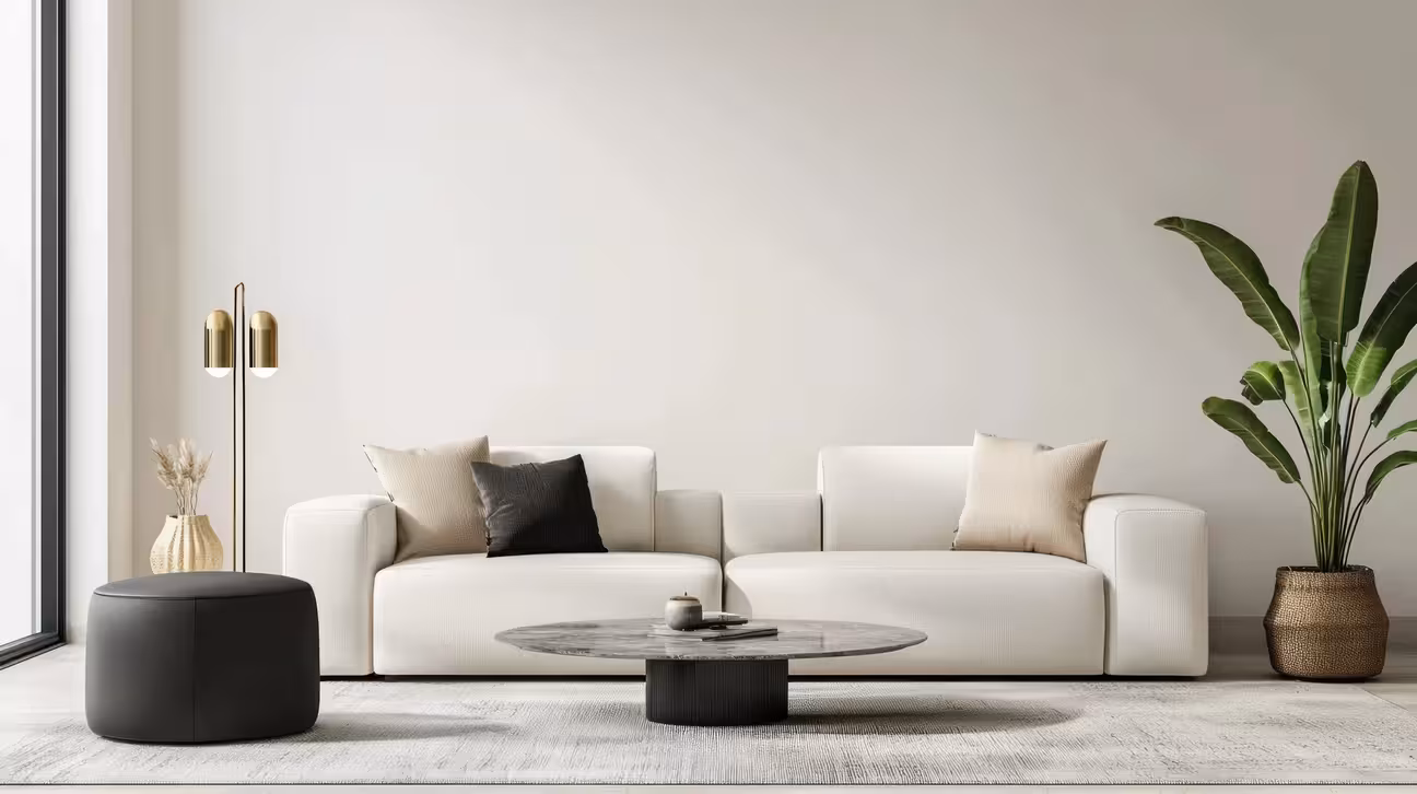 AI-generated Quiet Luxury living room with cream sofa, black marble coffee table, and gold floor lamp