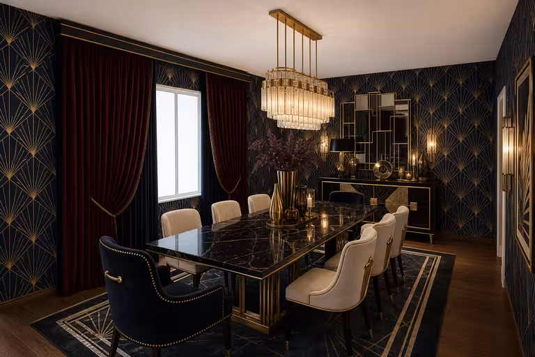 Art Deco dining room with black marble dining table, velvet chairs, gold accents, and geometric wallpaper