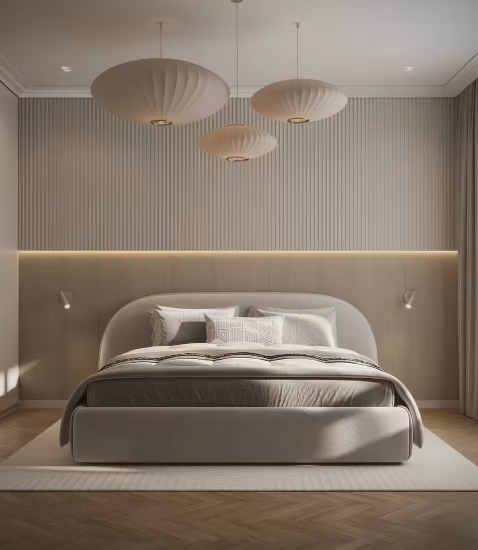 Modern bedroom with minimalist design, featuring a curved upholstered bed, neutral beige tones, textured wall paneling, soft ambient lighting, and three pendant lamps.