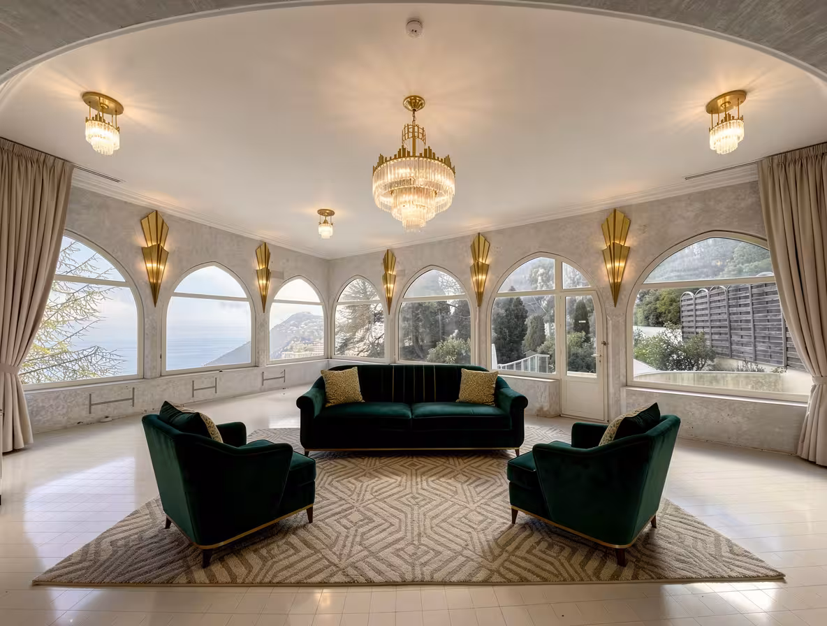 Art Deco living room with emerald velvet sofa, crystal chandeliers, arched windows, and gold wall sconces.
