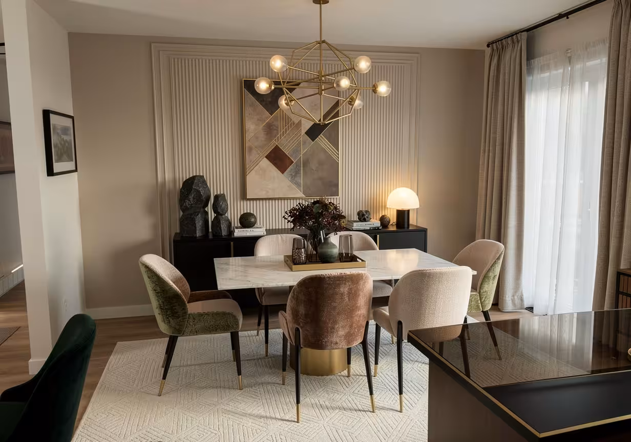 Neo Deco dining room with velvet accent chairs, geometric chandelier, dark sideboard, and abstract wall art