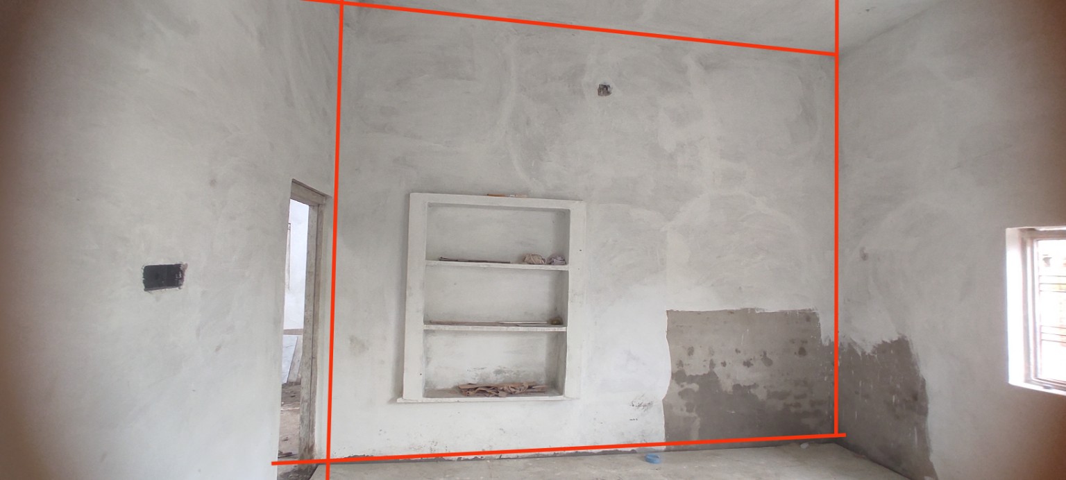 An under construction room space featuring a large tall wall.
